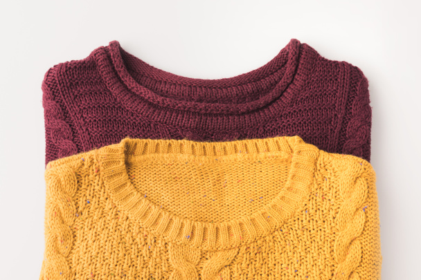 knitted burgundy and yellow sweaters - Zdjęcie, obraz