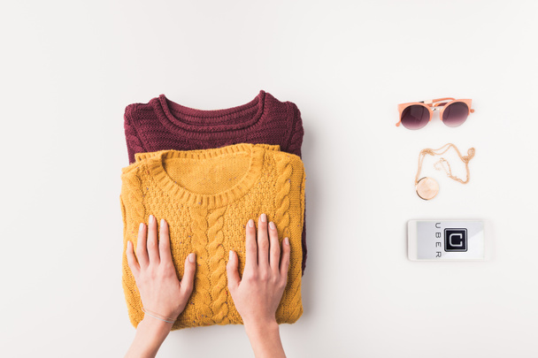 sweaters and smartphone with uber appliance - Foto, immagini