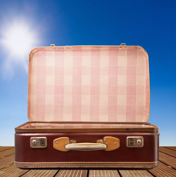 vintage suitcase on sky background - Фото, изображение