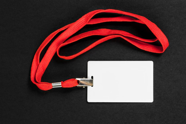 Empty card ID / icon with an orange belt on a black background.  - Photo, Image