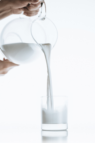 person pouring milk - Foto, Imagem