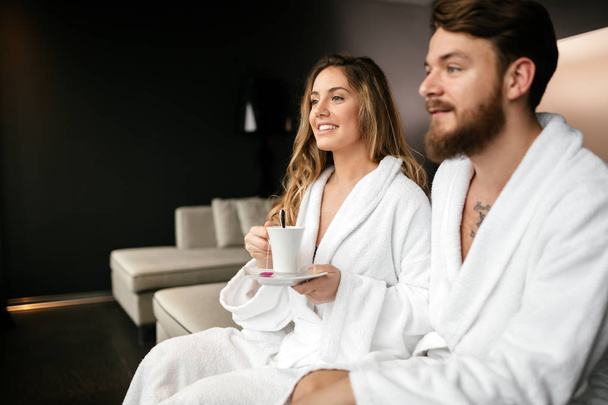 Couple wearing bathrobes in hotel - Foto, afbeelding