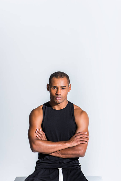 confident young african american sportsman with crossed arms looking at camera isolated on grey - Photo, image