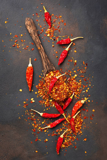 Red hot chili peppers on rusty background - Photo, Image