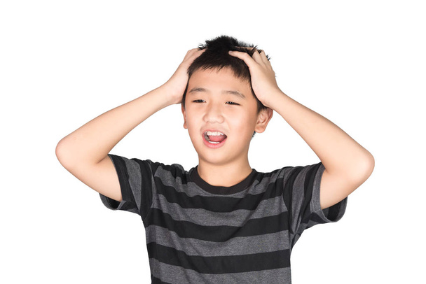 Asian boy kid holding his head frowning with screaming. pulling  - Фото, изображение
