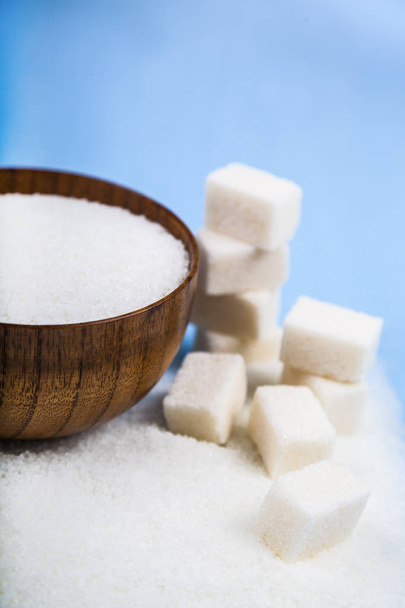 Sugar in a bowl and cubes of sugar  - Photo, Image