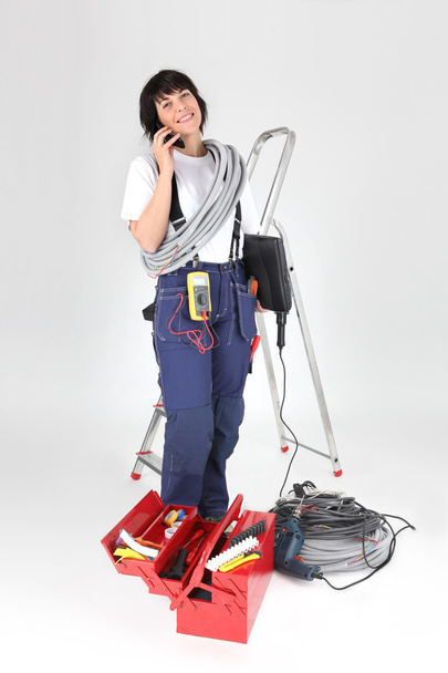 vrouw elektricien met tools - Foto, afbeelding
