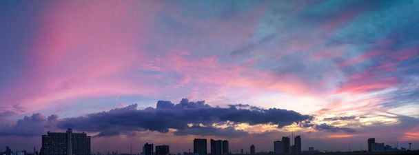 Panorama of twilight sky and cloud at sunset over the city - Photo, Image