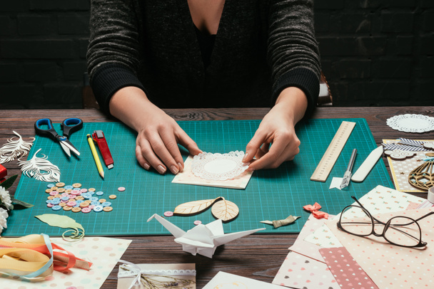 cropped image of woman making scrapbooking handmade postcard - Photo, Image