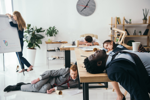 multiethnic group of exhausted businesspeople sleeping at office - Photo, Image