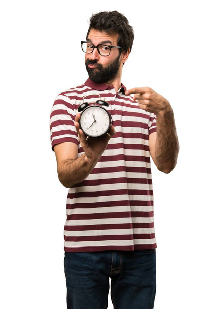Man with glasses holding vintage clock - Foto, immagini