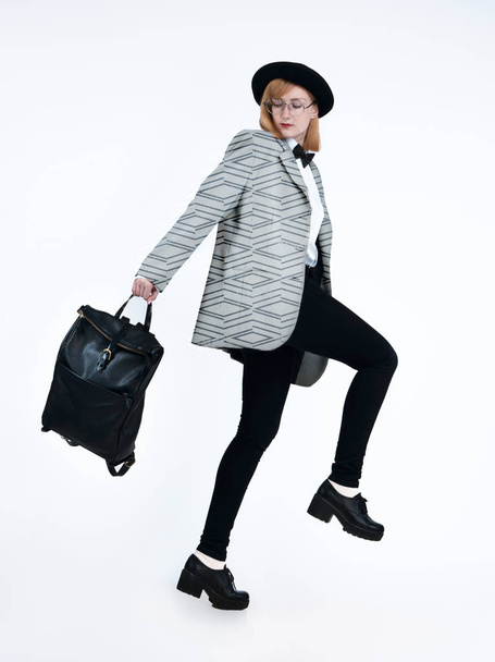 Stylish charming lady, dressed in retro style clothes with backpack - Photo, Image