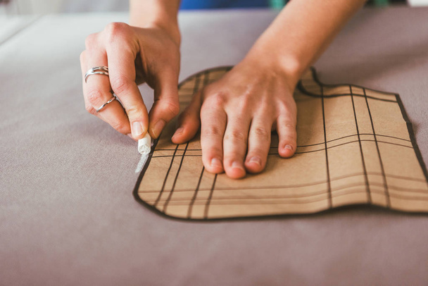 cropped image of dressmaker marking fabric with piece of chalk - Photo, Image