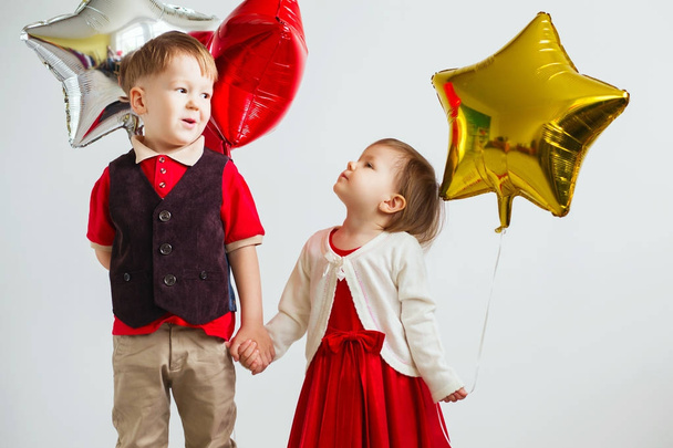 Children holding a star shaped balloons.  - Photo, Image