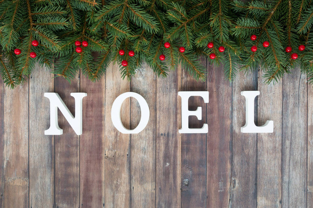 Christmas Border with Fir, Red Berries and Noel Letters  - Photo, Image
