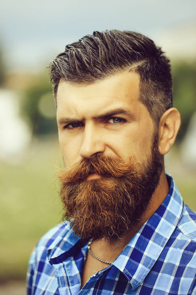 Frown bearded man outdoor - Photo, Image