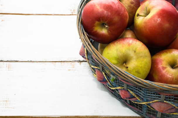 Basket of apples, fresh fruits on market table - Фото, изображение