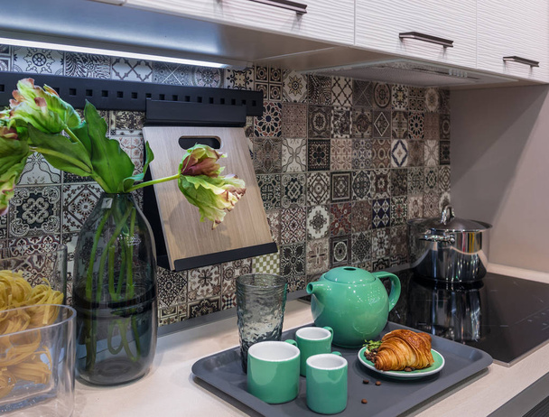 Morning breakfast on a tray in the modern kitchen interior. - Photo, Image
