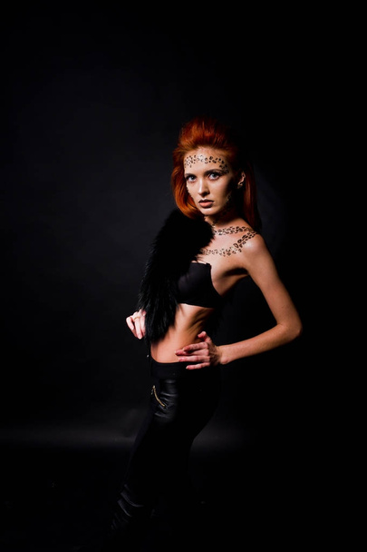 Fashion model red haired girl with originally make up like leopa - Valokuva, kuva