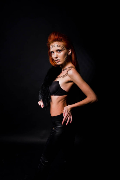 Fashion model red haired girl with originally make up like leopa - Fotó, kép