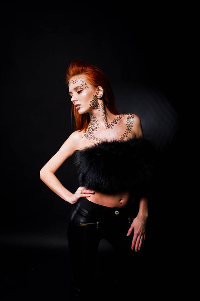 Fashion model red haired girl with originally make up like leopa - 写真・画像