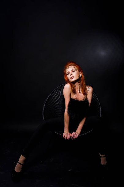 Fashion model red haired girl with originally make up like leopa - Fotó, kép