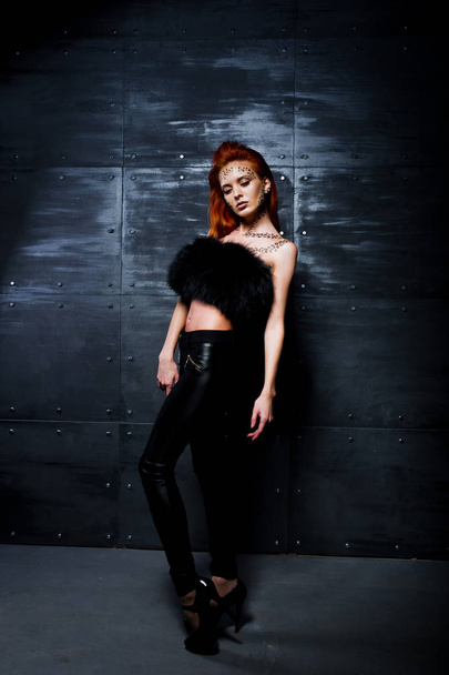 Fashion model red haired girl with originally make up like leopa - Foto, Bild