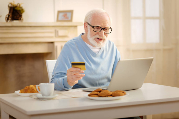 Attentive male doing online shopping - Foto, Imagem