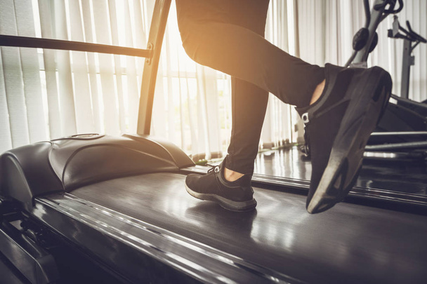 Healthy People running on machine treadmill at fitness gym - Фото, зображення