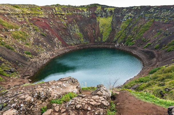above view of Kerid lake in volcanic crater - Foto, afbeelding