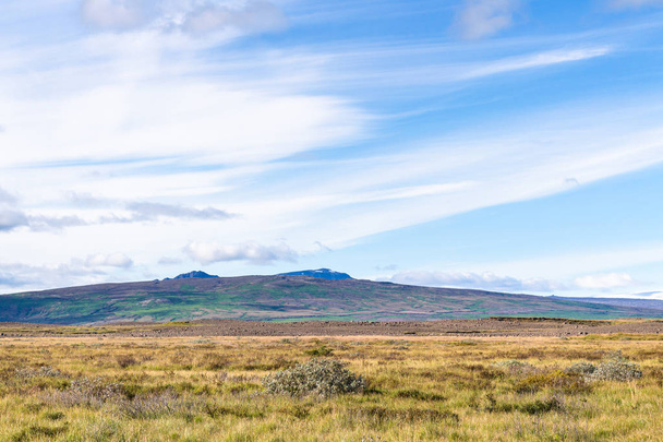 blue sky with white clouds over icelandic meadow - Φωτογραφία, εικόνα