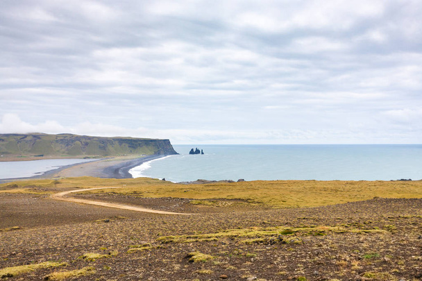 Dyrholaey promontory and volcanic beach in Iceland - Fotoğraf, Görsel