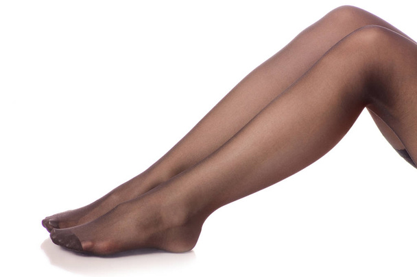 Female legs black stockings tights - Foto, afbeelding