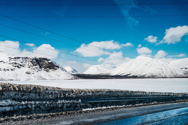 far to the north, blue cold sky, high snow-capped mountains, everywhere white snow - Zdjęcie, obraz