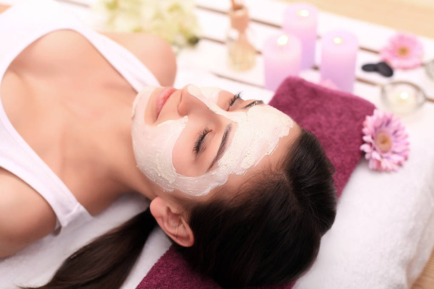 Spa therapy for young woman having facial mask at beauty salon - - Photo, Image