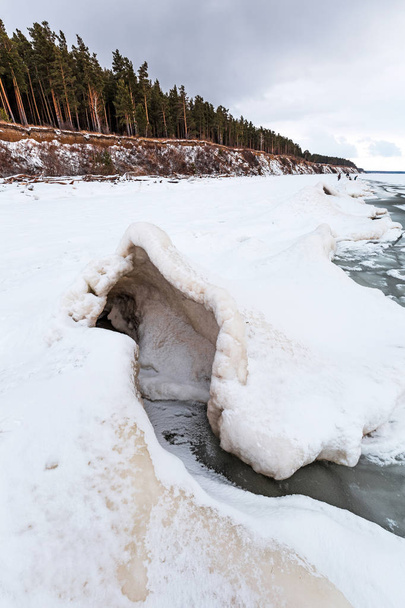 Snow-ice pyramid with craters on the frozen Novosibirsk reservoir Ob. The river Ob, Novosibirsk oblast, Siberia, Russia - Zdjęcie, obraz