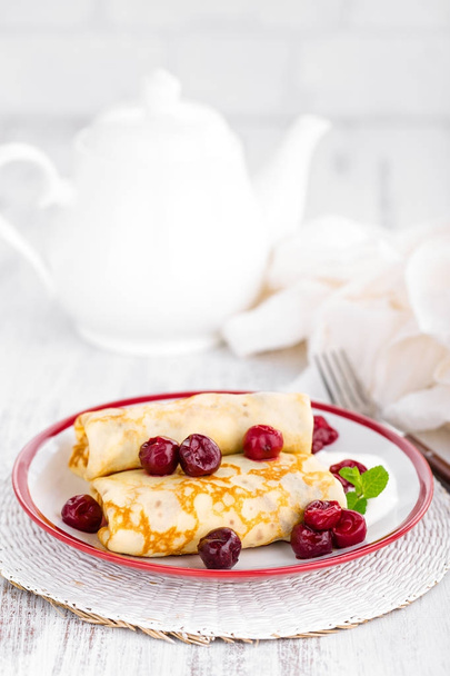 Sweet pancakes with cherry - 写真・画像
