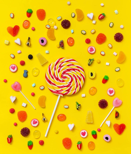 colorful candy on the yellow background - Foto, imagen