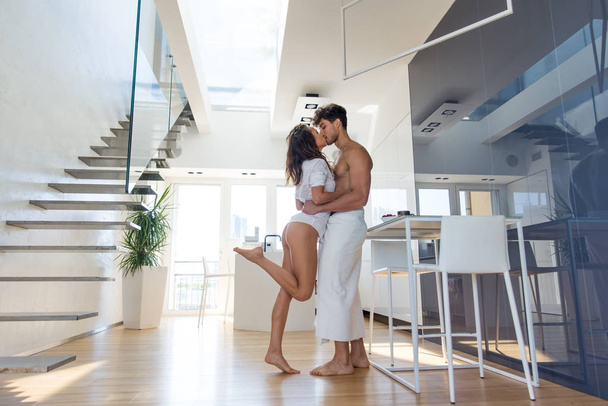 Couple of lovers in a penthouse - Фото, изображение