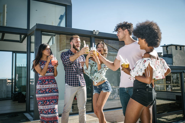 Friends partying on a rooftop - Photo, Image