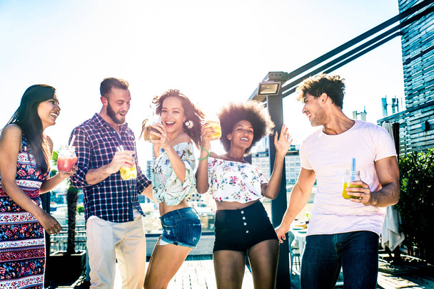 Friends partying on a rooftop - 写真・画像