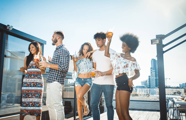 Friends partying on a rooftop - Photo, Image