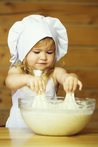 happy boy child cook kneading dough - Foto, Imagem