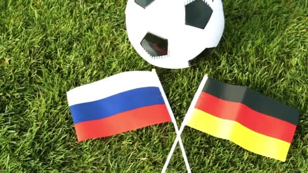 Футбольный мяч и флаги России и Германии. Футбол, чемпионат мира
. - Кадры, видео