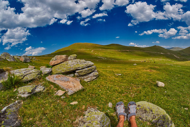 Tourist feet high-altitude abstract mountain landscape  - Fotografie, Obrázek