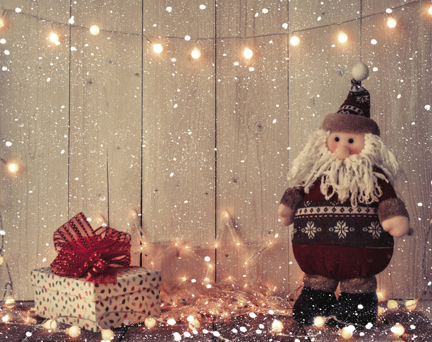 santa claus, gift boxes and lights - Foto, Imagen