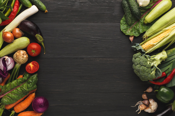 Border of fresh vegetables on wooden background with copy space - 写真・画像