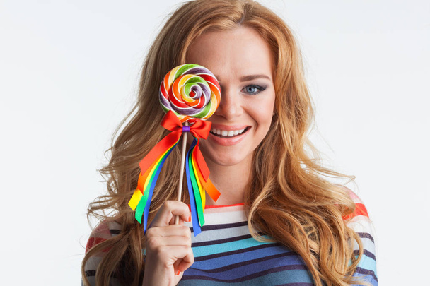 Girl with colorful lollipop - Fotoğraf, Görsel