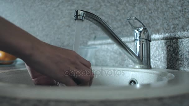 Female washing vegetables under the tap. - Footage, Video