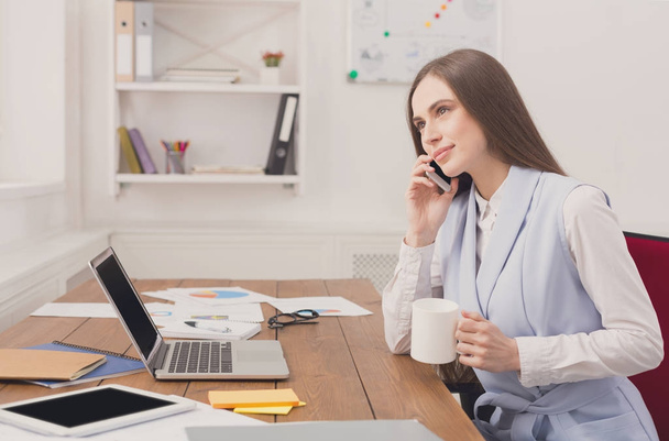 Business talk, woman consulting by phone at office - Фото, зображення